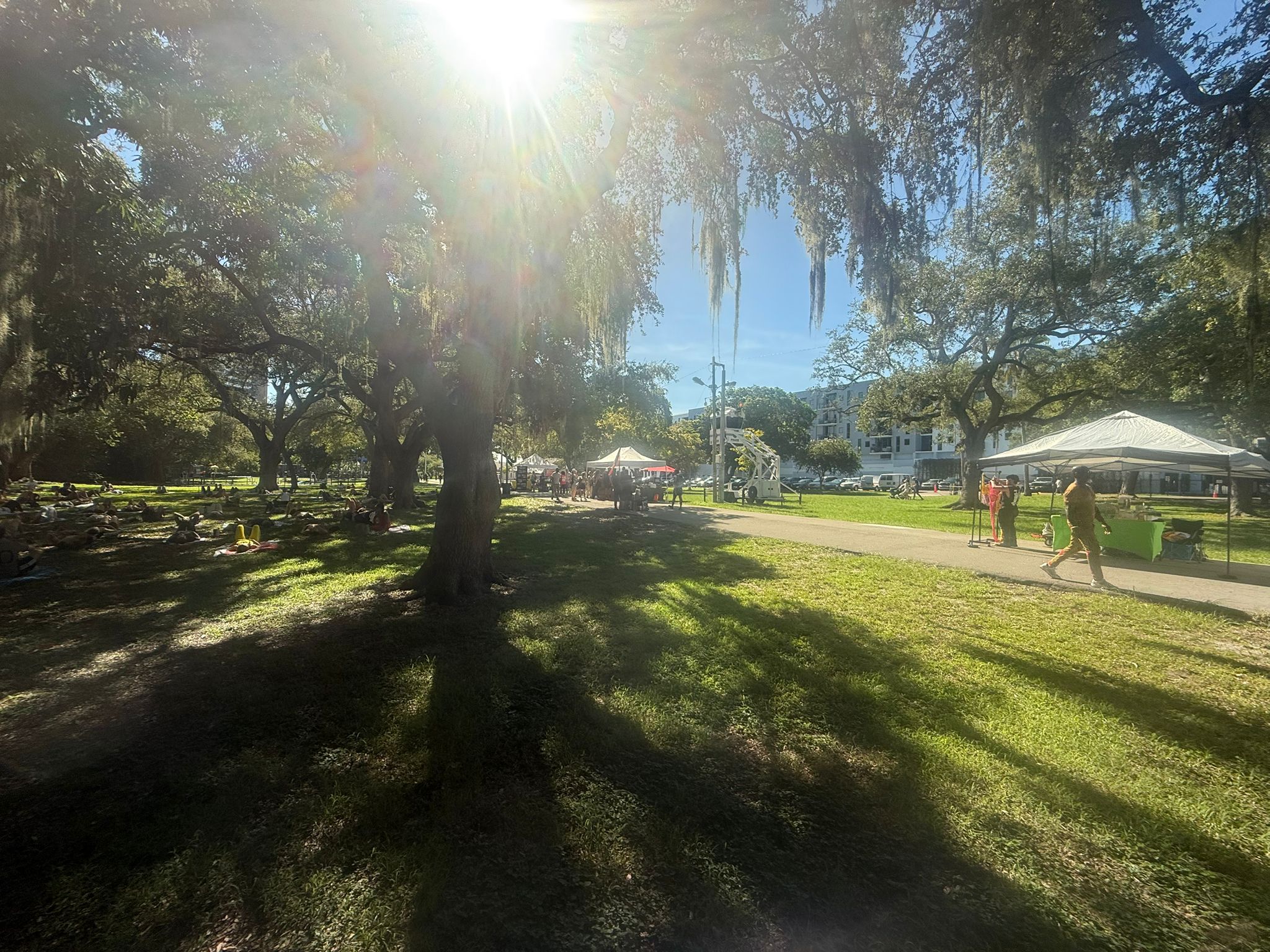 Yoga session with farmers market in background